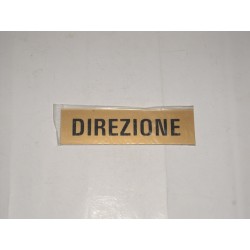 targa in plastica incisa oro adesiva "DIREZIONE" 150X40MM. T00735